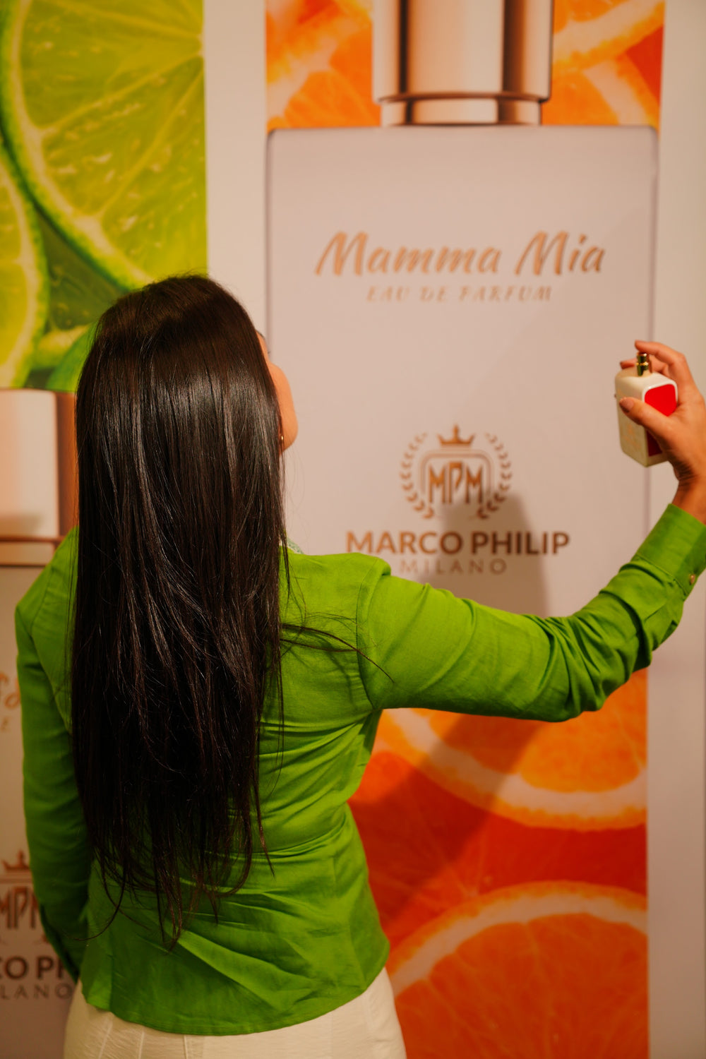 A Mamma Mia visual at the booth, with citrus imagery around the bottle